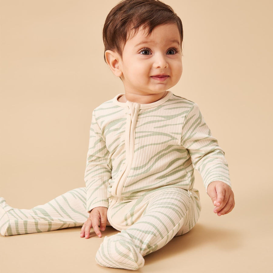 Zebra Stripe Ribbed Zip Sleepsuit on a baby